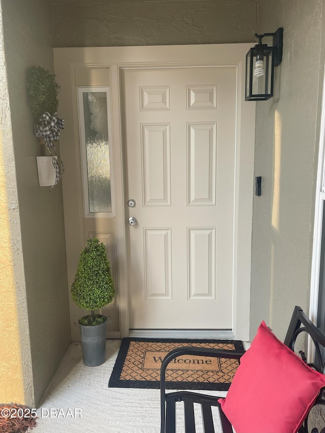 property entrance featuring stucco siding