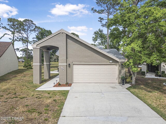 108 Shoal Creek Cir, Daytona Beach, FL 32114 - mid-century inspired home with a garage, stucco siding, driveway, and a front yard