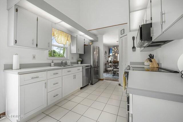 108 Shoal Creek Cir, Daytona Beach, FL 32114 - kitchen featuring a sink, light tile patterned flooring, white cabinetry, light countertops, and stainless steel dishwasher