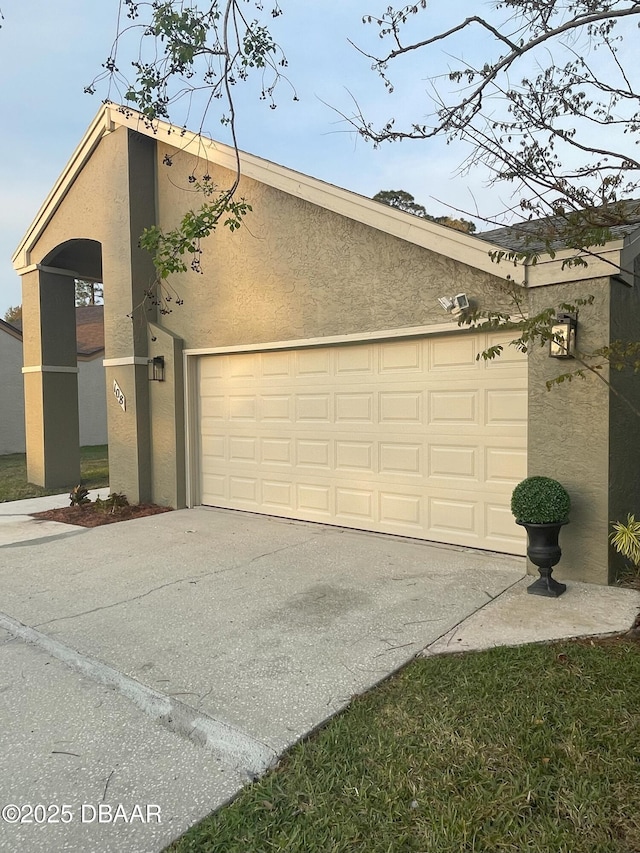 garage featuring driveway