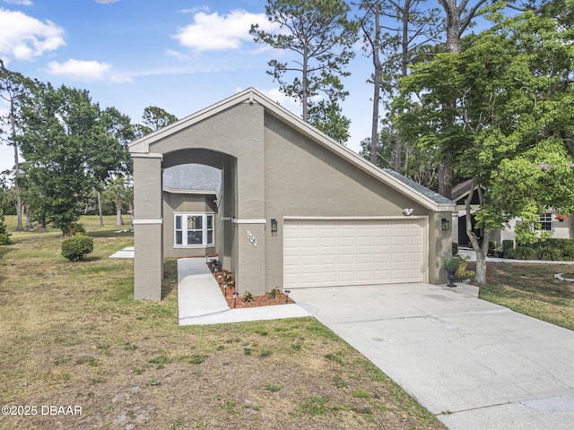 108 Shoal Creek Cir, Daytona Beach, FL 32114 - view of front facade with a garage, a front lawn, stucco siding, and driveway