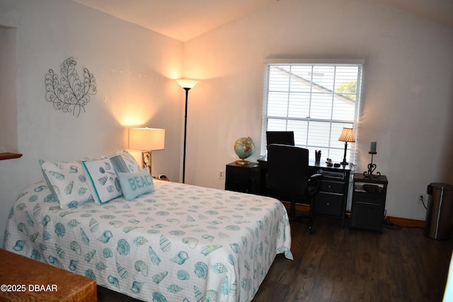 bedroom with dark wood-style floors and lofted ceiling