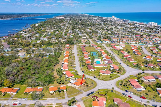 birds eye view of property with a water view