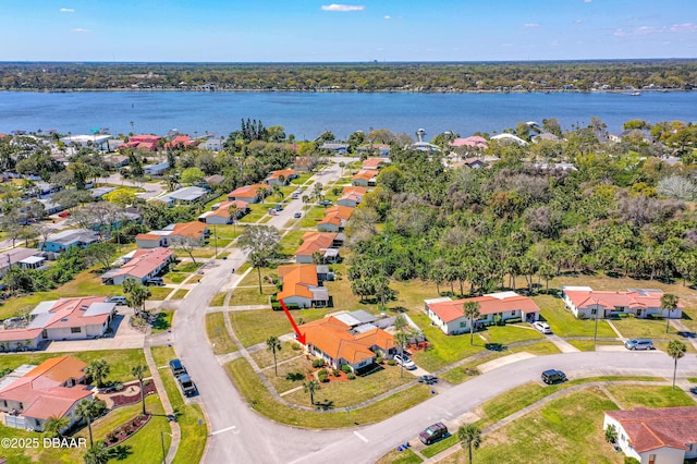 birds eye view of property featuring a residential view and a water view