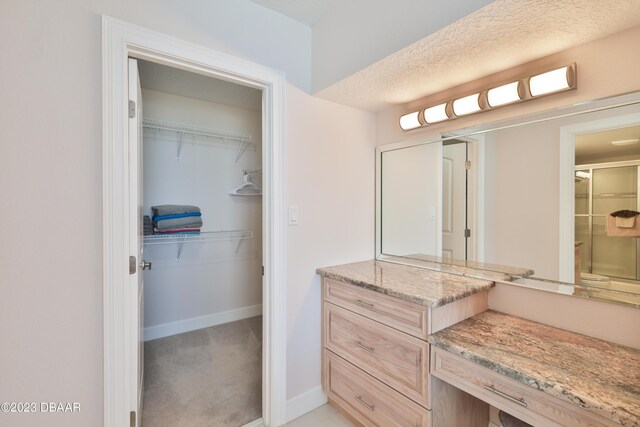 bathroom with a textured ceiling