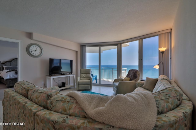 living room with a wall of windows and a textured ceiling