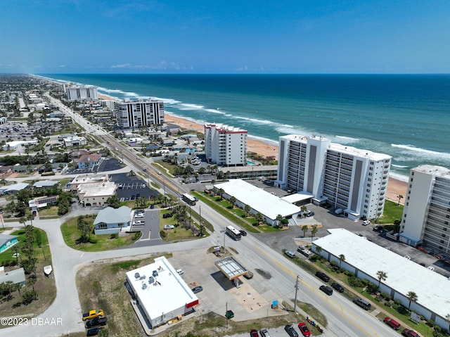 aerial view with a water view and a view of the beach