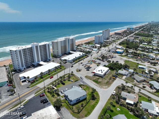 aerial view with a water view and a view of the beach