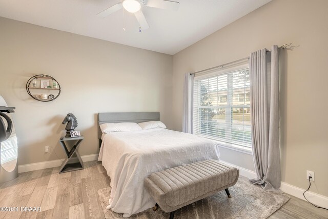 bedroom featuring ceiling fan and light wood-type flooring