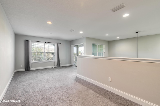 unfurnished room featuring carpet flooring