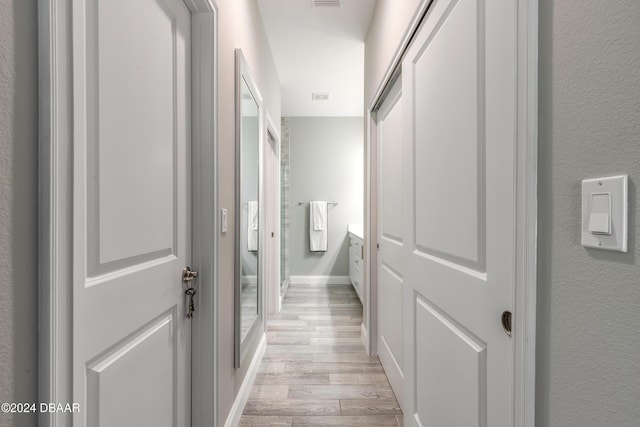 hall featuring light hardwood / wood-style flooring