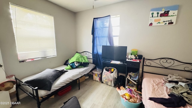 bedroom with light wood-type flooring