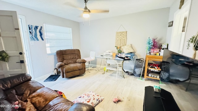 interior space with ceiling fan and wood-type flooring