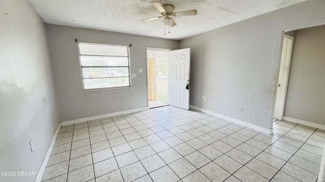 empty room featuring ceiling fan and a textured ceiling