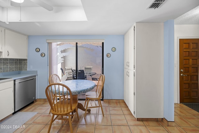 tiled dining room with ceiling fan