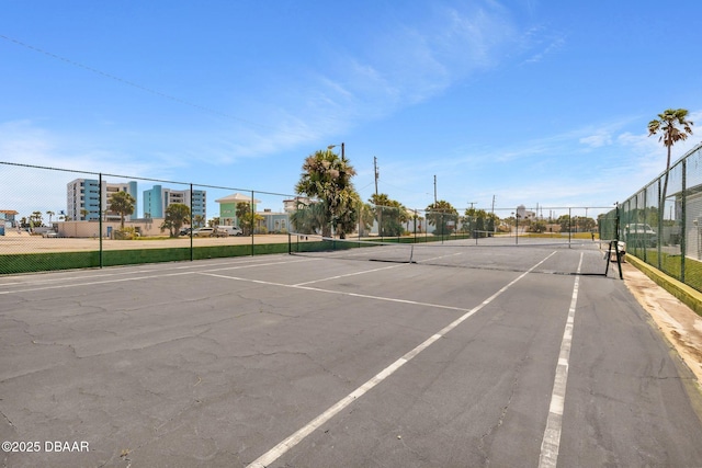 view of sport court featuring fence
