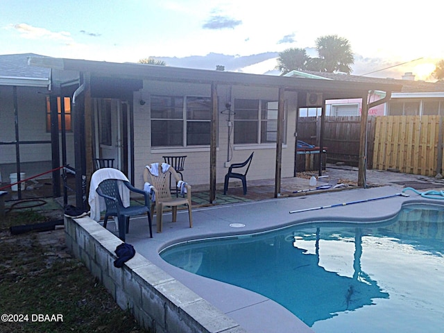 view of swimming pool with a patio