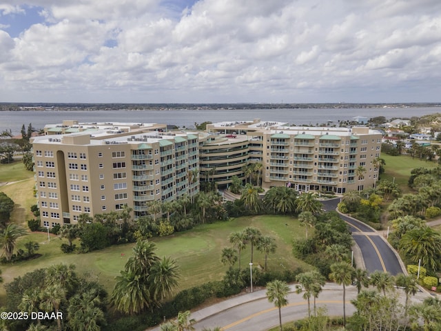 birds eye view of property with a water view