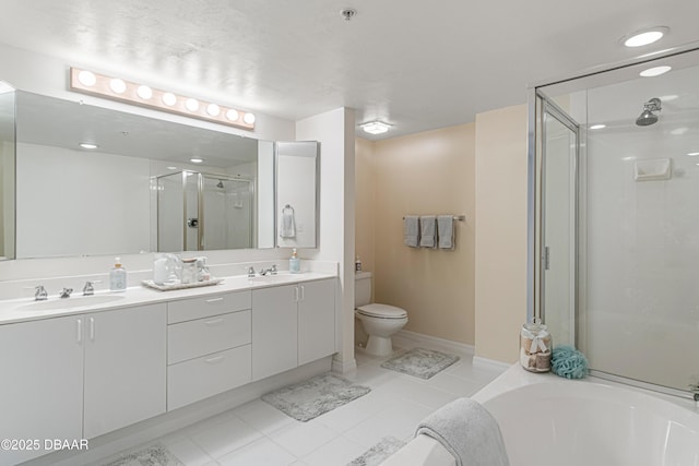 full bath featuring double vanity, a shower stall, a sink, and tile patterned flooring