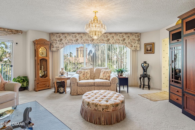 living area with carpet flooring, a textured ceiling, and a notable chandelier