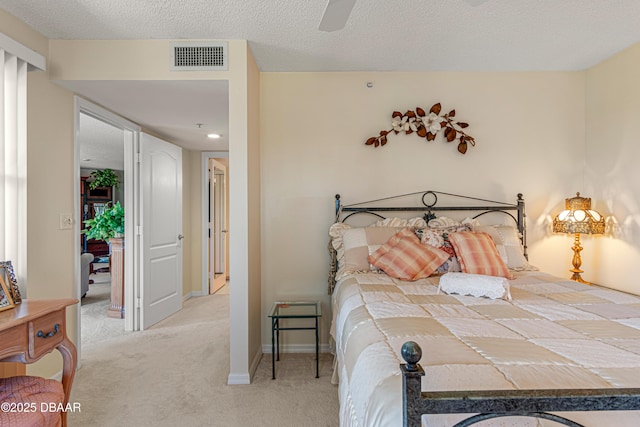 bedroom featuring baseboards, ceiling fan, carpet flooring, and visible vents