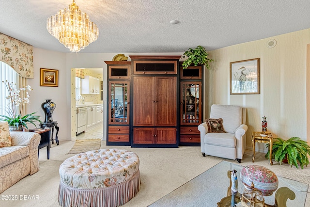 living room with a textured ceiling, an inviting chandelier, light carpet, and plenty of natural light