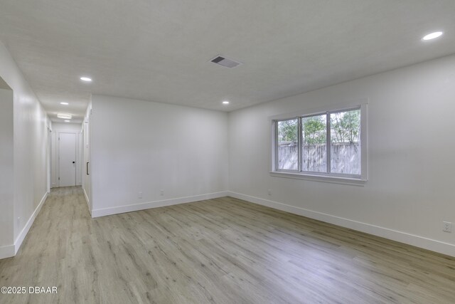 1704 Travelers Palm Dr, Edgewater, FL 32132 - unfurnished room with light wood-style flooring, baseboards, and recessed lighting