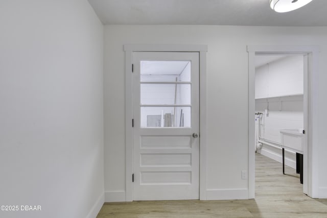 1704 Travelers Palm Dr, Edgewater, FL 32132 - doorway with light wood-type flooring and baseboards