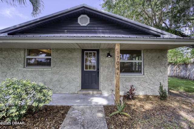 1704 Travelers Palm Dr, Edgewater, FL 32132 - entrance to property featuring stucco siding and fence