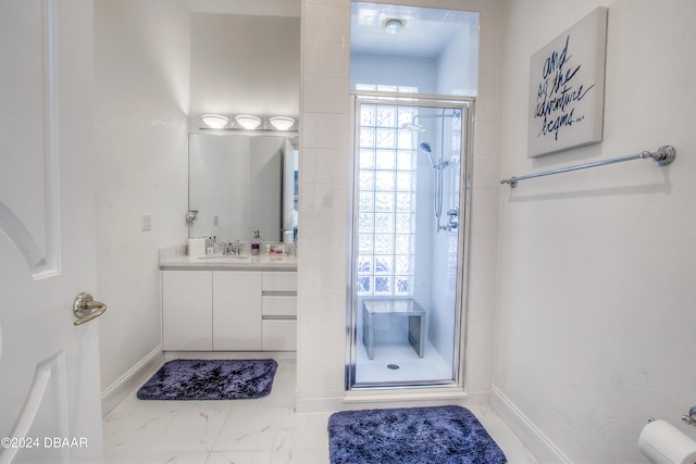 bathroom with walk in shower and vanity