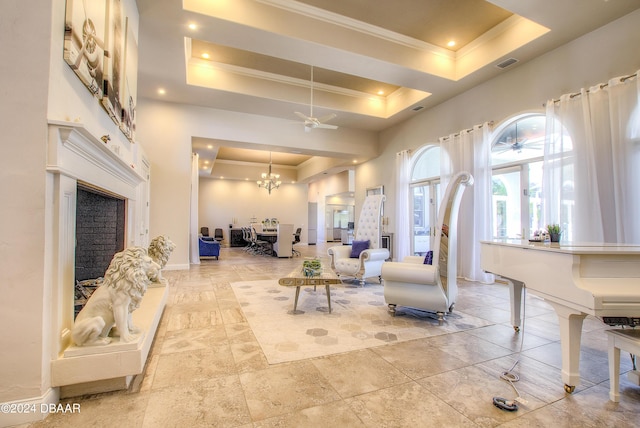 2540 Taxiway Echo, Port Orange, FL 32128 - living room with a raised ceiling, ornamental molding, recessed lighting, ceiling fan, and a high end fireplace