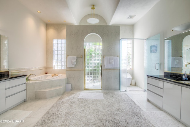 2540 Taxiway Echo, Port Orange, FL 32128 - bathroom featuring tile patterned floors, vanity, a bath, and an enclosed shower