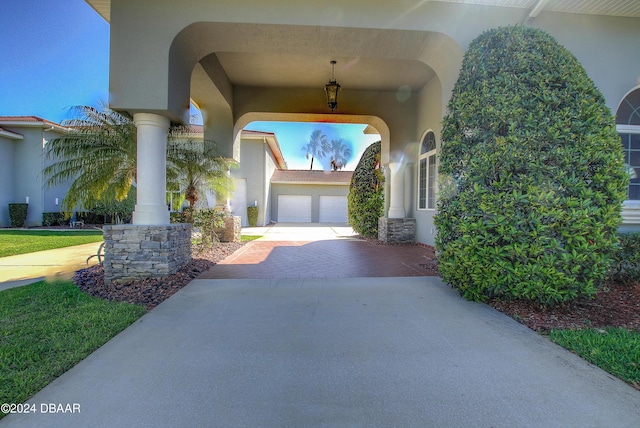 2540 Taxiway Echo, Port Orange, FL 32128 - view of patio with concrete driveway and a garage