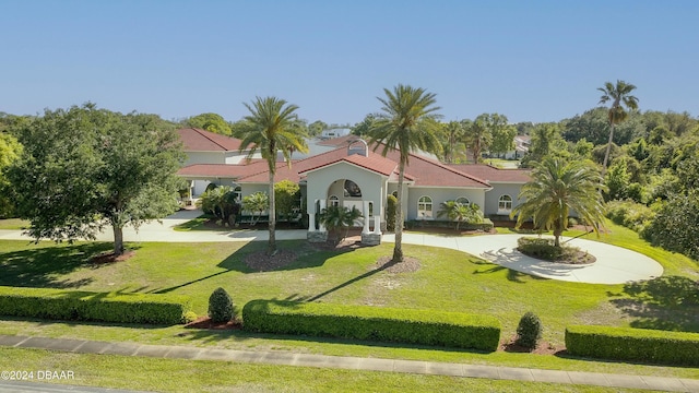 2540 Taxiway Echo, Port Orange, FL 32128 - view of front of house featuring a front lawn, stucco siding, and a tile roof