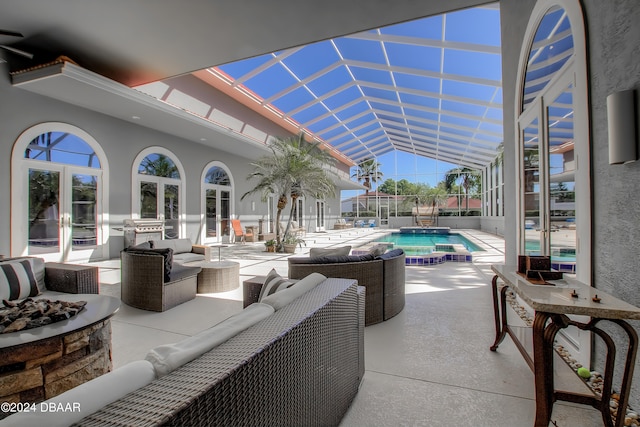 view of patio / terrace with a lanai, french doors, and outdoor lounge area