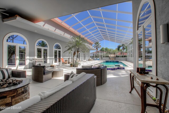 2540 Taxiway Echo, Port Orange, FL 32128 - view of patio featuring french doors, an outdoor living space with a fire pit, a lanai, and a pool with connected hot tub