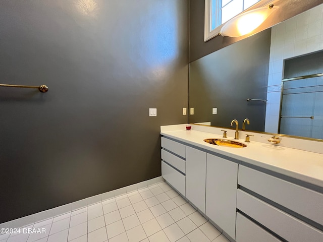 bathroom with vanity and tile patterned flooring