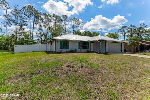 ranch-style house with a garage, driveway, a front yard, and fence