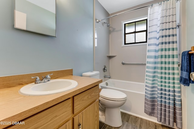 bathroom with shower / bath combo with shower curtain, wood finished floors, vanity, and toilet