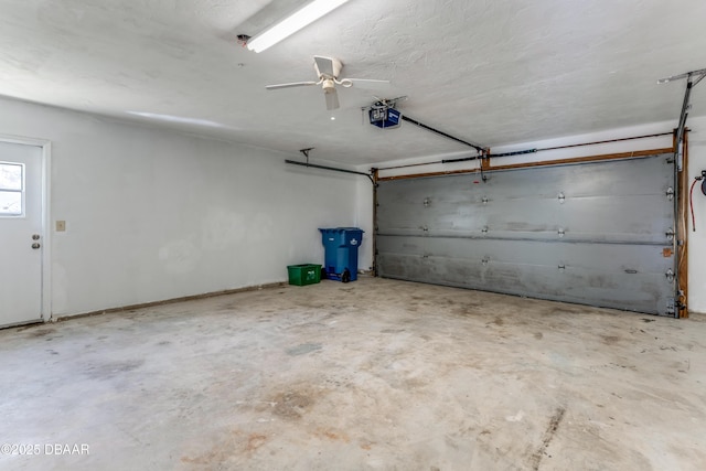 garage with ceiling fan and a garage door opener