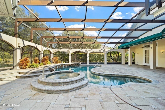 view of pool with an in ground hot tub and a patio area