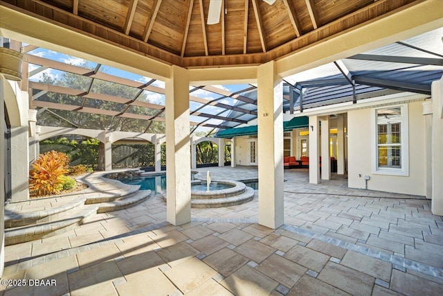 view of patio / terrace with a gazebo and glass enclosure