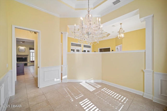 interior space featuring an inviting chandelier, light tile patterned floors, and crown molding