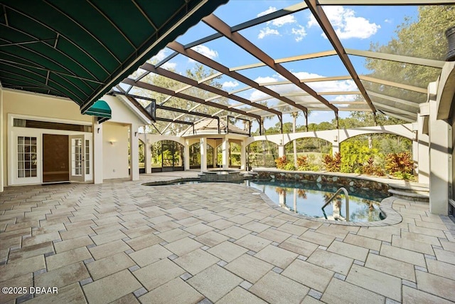 view of pool featuring a patio and glass enclosure