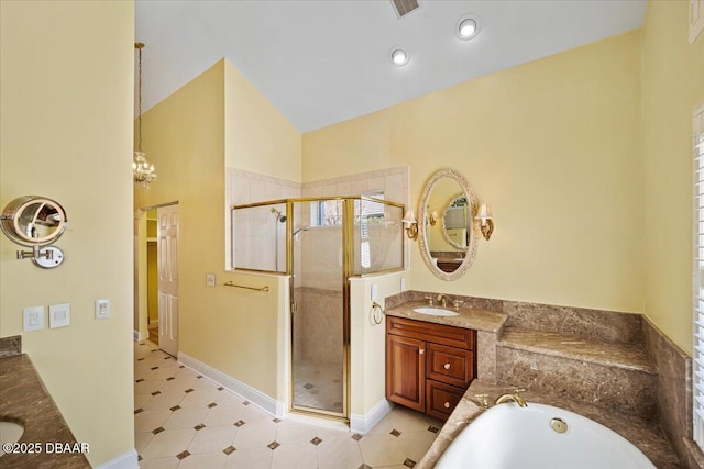 bathroom with vanity, lofted ceiling, and plus walk in shower