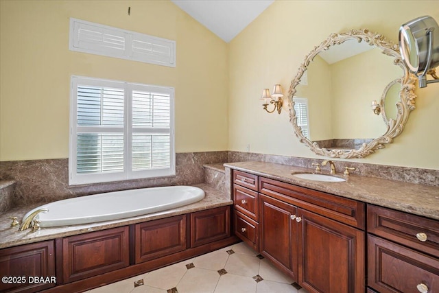 bathroom featuring vanity, a bath, tile patterned flooring, and vaulted ceiling