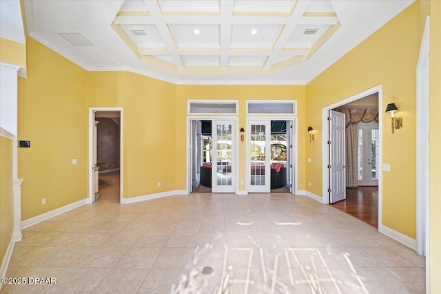 tiled empty room with coffered ceiling, a towering ceiling, and french doors