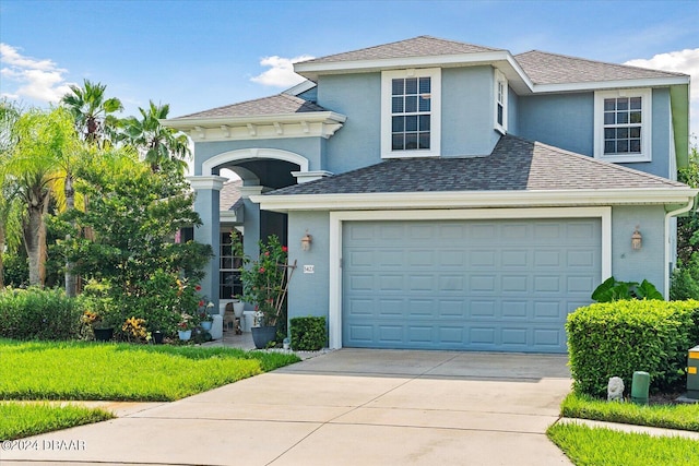 front of property with a garage