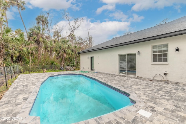 view of swimming pool featuring a patio