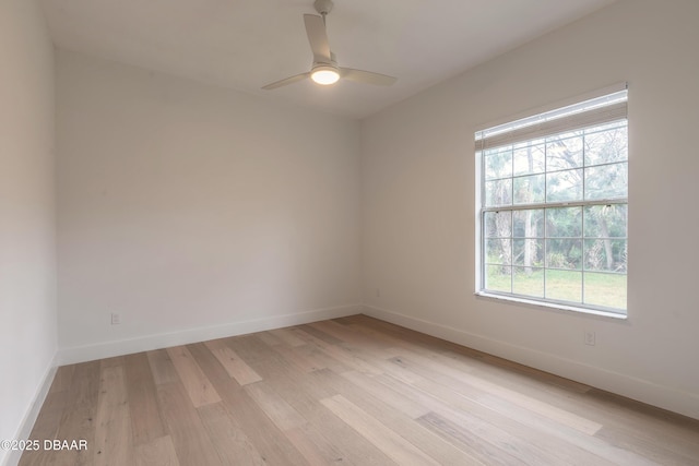 unfurnished room featuring ceiling fan and light wood-type flooring